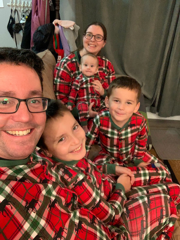 Krista and her family at Christmastime wearing matching pajamas